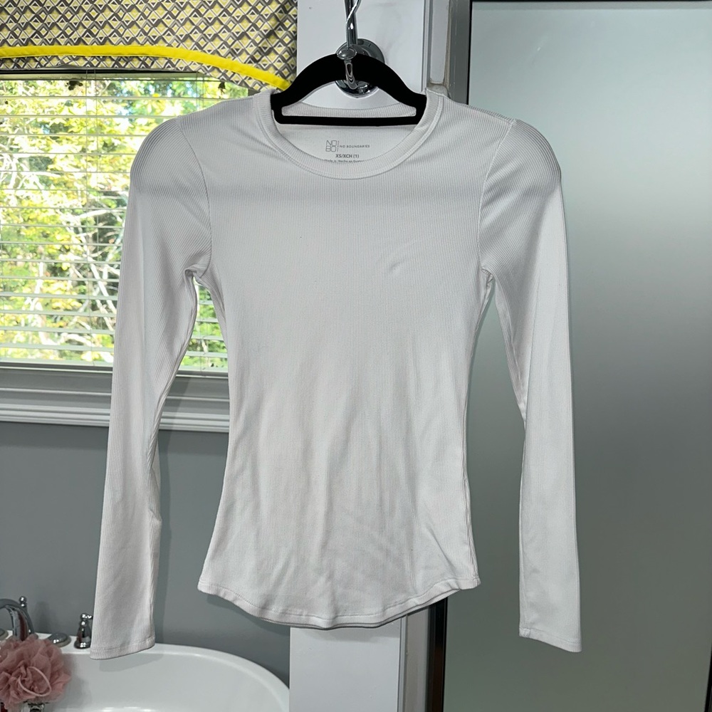 This is a beautiful white top, that can be tucked into jeans with a cardigan